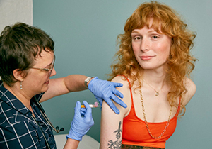 A person getting vaccinated at a clinic.